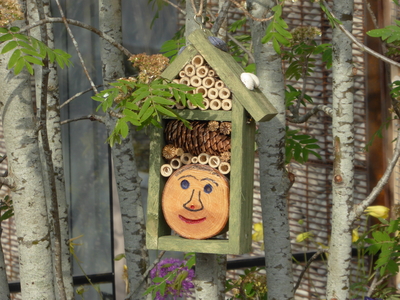 insect hotel smiley face