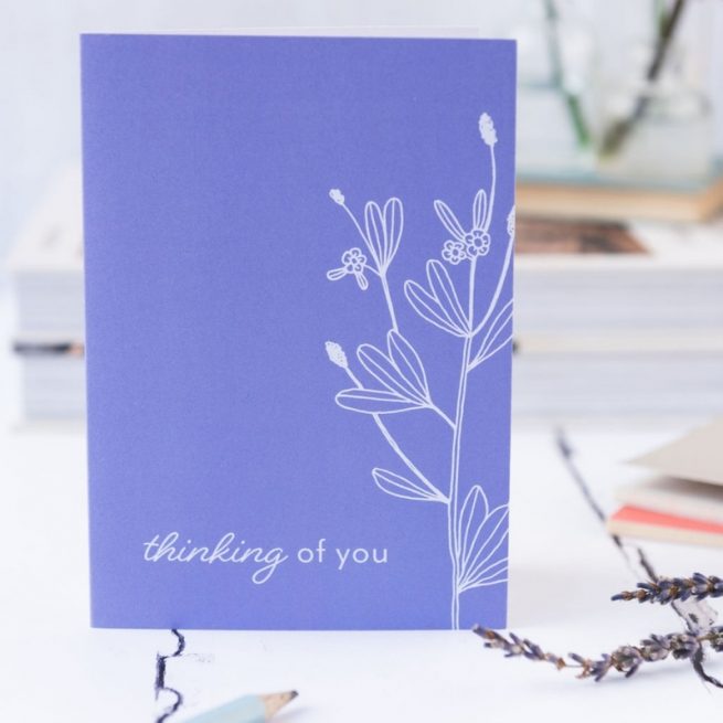 thinking of you card purple background with white floral illustration