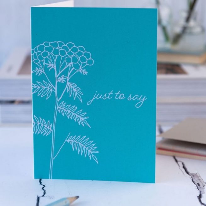 Just to say card, teal bacground with botanical illustration