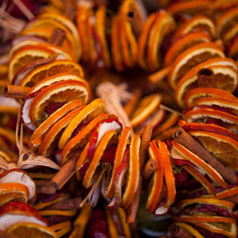 dried orange slices formed into a ring with cinnamon sticks