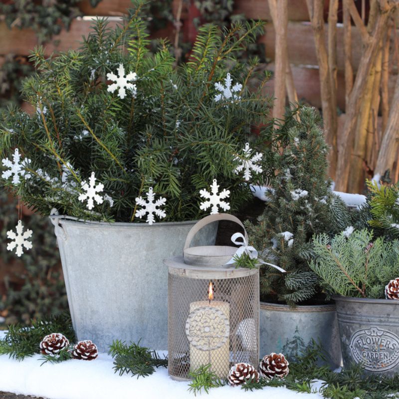 zinc planters with snowflakes and fir trees