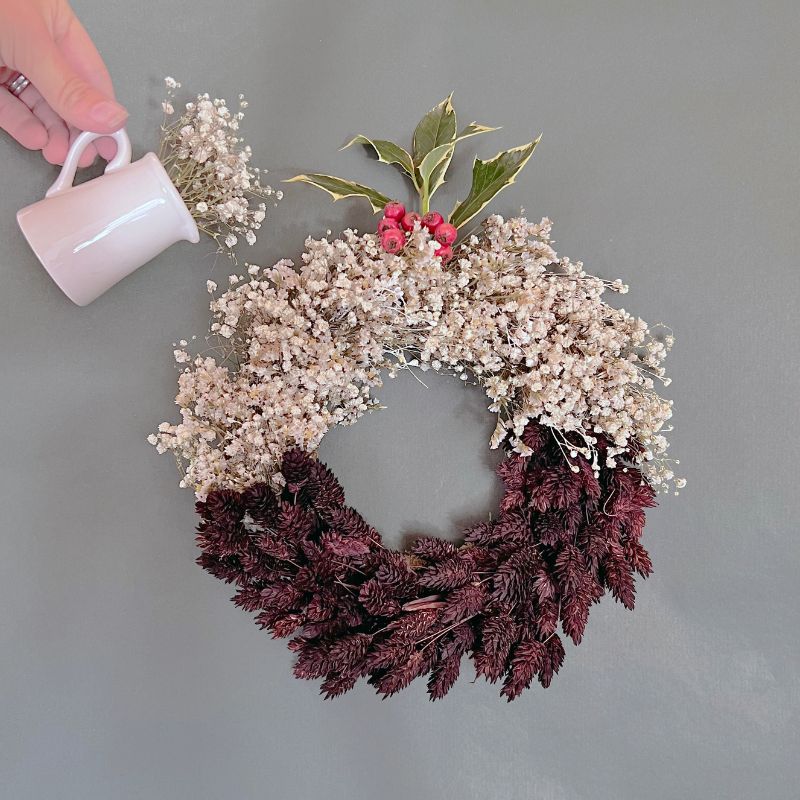 dried flower wreath shaped like a christmas pudding