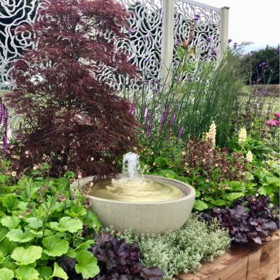 water feature bowl surrounded by sensory planting