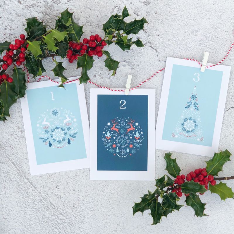 advent calendar with twine, pegs and holly decoration