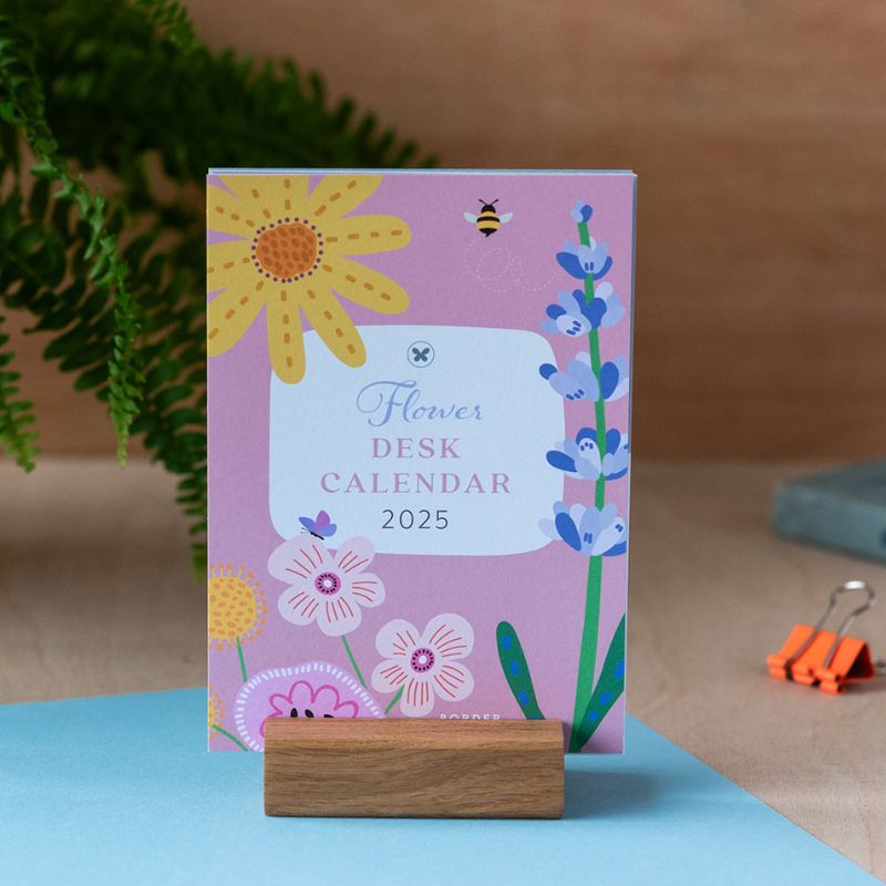 desk calendar floral design in a wooden stand