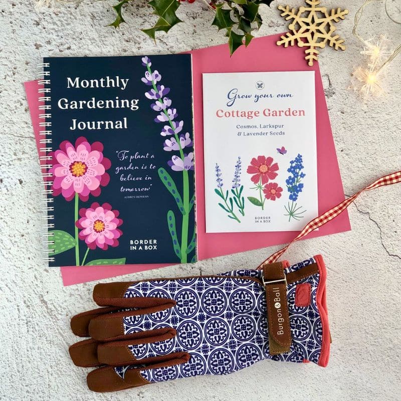 garden journal, blue gloves and cottage garden seed collection