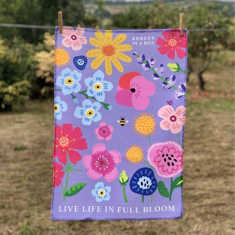 tea towel floral design with purple background